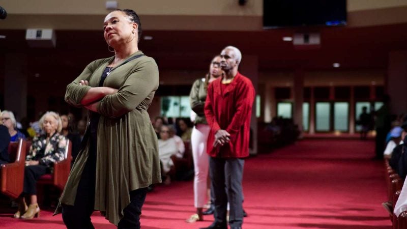 Members of the audience listen as the panel on stage replies to raised questions during the Courageous Conversations: Reimagining Race and Education forum at Enon Tabernacle Church, on Thursday. (Bastiaan Slabbers for WHYY)