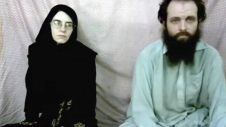 This still image made from a 2013 video released by the Coleman family shows Caitlan Coleman and her husband, Canadian Joshua Boyle, in a militant video given to the family. A woman in a burka dn a bearded man; American and Canadian, who've been in captivity