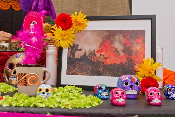 An image from forest fires to represent those killed in California is displayed on the 2017 Day of the Dead Altar at the Penn Museum. (Kimberly Paynter/WHYY)