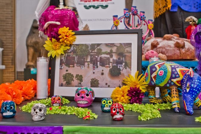 An image from Hurricane Harvey’s flooding is displayed on the 2017 Day of the Dead Altar at the Penn Museum. (Kimberly Paynter/WHYY)