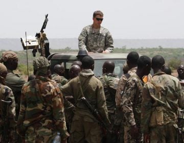 Malian special forces listen to instructions from a US Special Forces soldier on counter-ambush tactics in Kita, Mali, during a joint training exercise. (AP Photo / Alfred de Montesquiou)
