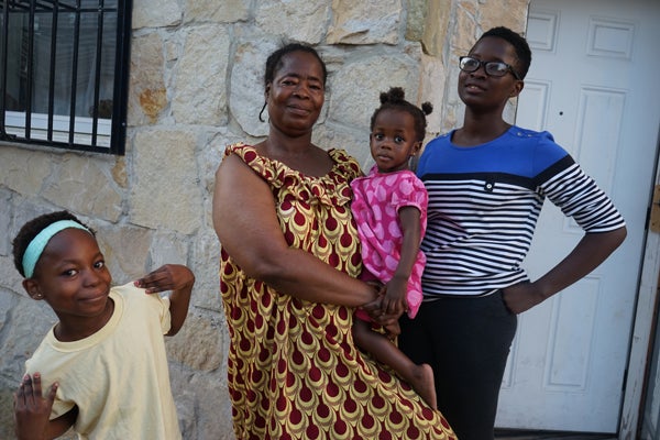 Four of the five Angama women in bright colors