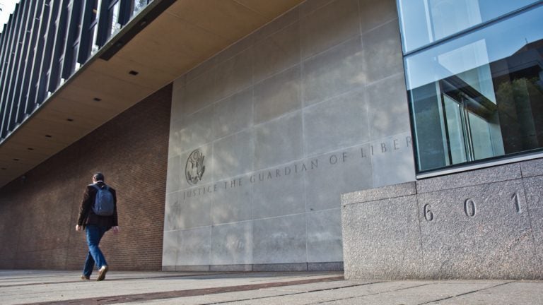 A man walks past the federal courthouse in Philadelphia