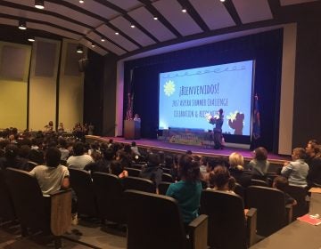 Students at Las Americas ASPIRA Academyu, a Delaware charter school, gather in the new auditorium for the presentation of summer reading awards. Scholastic Inc. honored them as the best in Delaware. (Cris Barrish/WHYY)