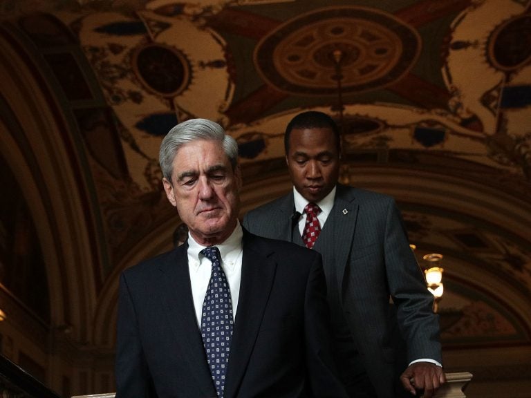 Special counsel Robert Mueller (left) arrives at the U.S. Capitol for closed meeting with members of the Senate Judiciary Committee on June 21 in Washington, D.C.