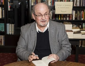 Author Salman Rushdie poses for photographers at a book signing in London, Tuesday, June 6, 2017. (Grant Pollard/Invision/AP)