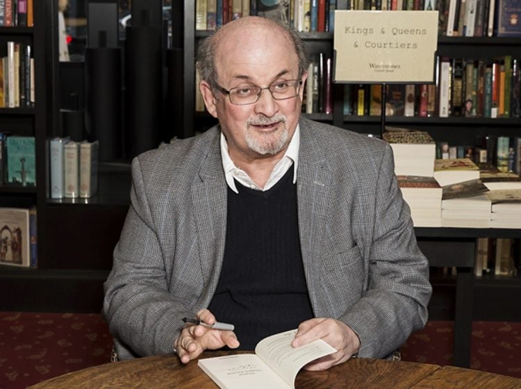 Author Salman Rushdie poses for photographers at a book signing in London, Tuesday, June 6, 2017. (Grant Pollard/Invision/AP)