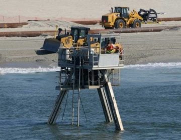 A Coastal Research Amphibious Buggy (CRAB) surveys the surf area of Brant Beach, NJ during a restoration project in June of 2013. (Photo by USACE)