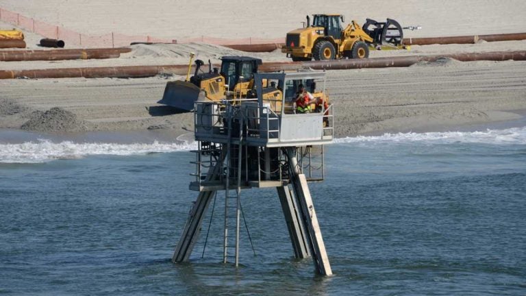 A Coastal Research Amphibious Buggy (CRAB) surveys the surf area of Brant Beach, NJ during a restoration project in June of 2013. (Photo by USACE)