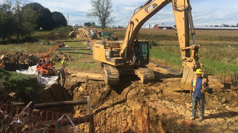 backhoe works at a construction site