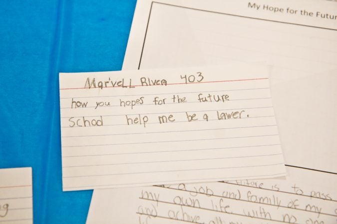 Mastery Cramer Hill Elementary school students filled a time capsule with their dreams at the school dedication in Camden Tuesday morning. (Kimberly Paynter/WHYY)