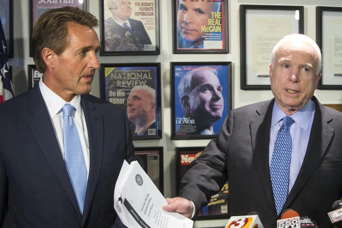 Arizona Sen. Jeff Flake, left, with the state's other senator, John McCain. (Charlie Leight / Associated Press)
