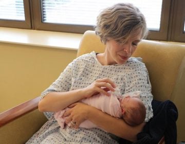 Jaime Martin holds her daughter, Ruby. She's 11 weeks old but was born so early that doctors still refer to her by her gestational age. (Emily Siner/WPLN)