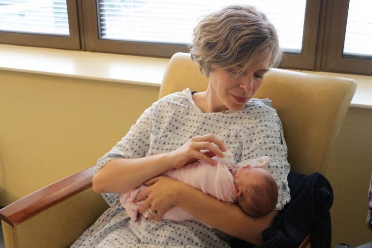 Jaime Martin holds her daughter, Ruby. She's 11 weeks old but was born so early that doctors still refer to her by her gestational age. (Emily Siner/WPLN)