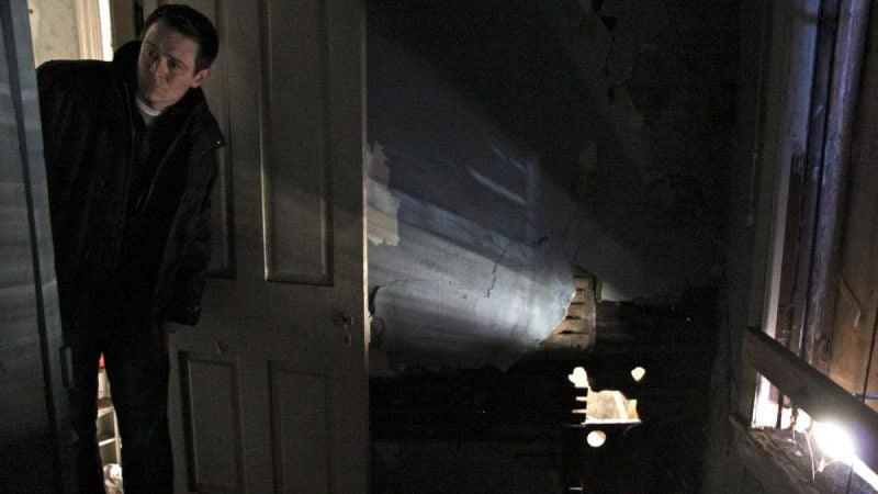 Civil rights activist Patrick Duff looks at the back bedroom where Martin Luther King Jr. stayed while he was a seminary student. (Emma Lee/WHYY)