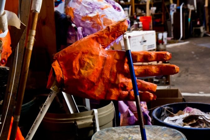 Giant puppet hands at the Spiral Q warehouse in West Philadelphia. (Kimberly Paynter/WHYY)