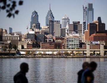 The Philadelphia skyline is seen along the banks of the Delaware River.