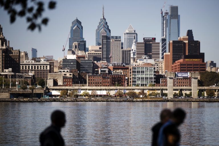 The Philadelphia skyline is seen along the banks of the Delaware River.