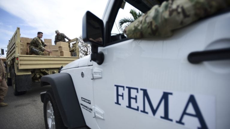 Department of Homeland Security personnel deliver supplies to Santa Ana community residents in the aftermath of Hurricane Maria in Guayama, Puerto Rico.