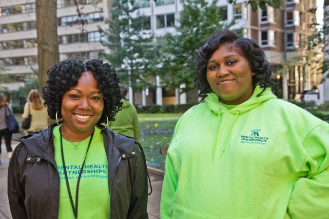 Ashley Cotton (left) and Sherika Morgan (right) are outreach specialists with Mental Health Partnerships in Philadelphia. They walk though Rittenhouse Square Park and invite people who are homeless to come to the New Life Recovery & Education Center.