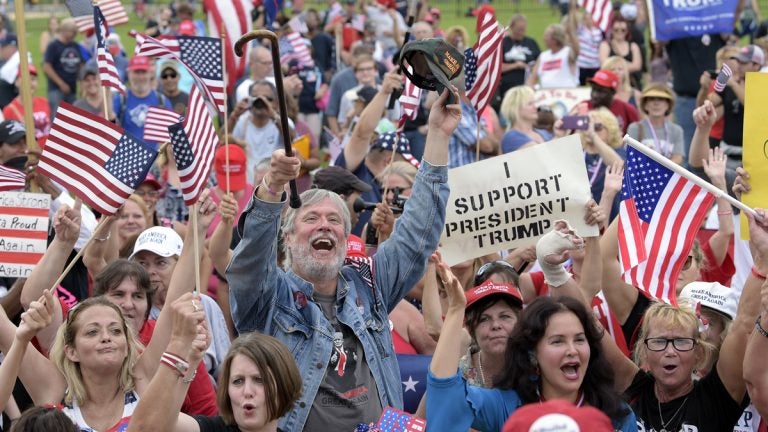 People gather on the National Mall in Washington, Saturday, Sept. 16, 2017, to attend a rally in support of President Donald Trump.