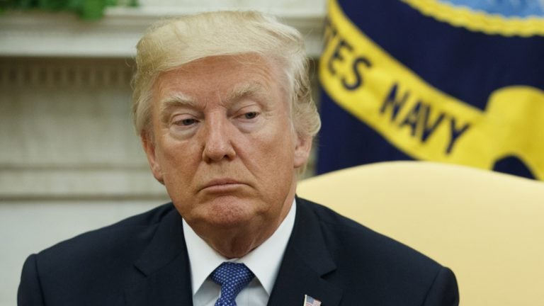 President Donald Trump is shown in the Oval Office of the White House.