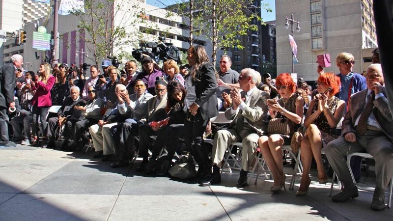 Music fans gather on the sidewalk outside the Kimmel Center, where eight new plaques were added to the Philadelphia Music Walk of Fame. (Emma Lee/WHYY)