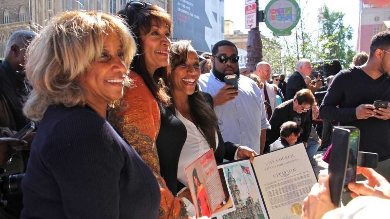 Members of the group Sister Sledge pose for photos after their plaque was added to the Philadelphia Music Walk of Fame.