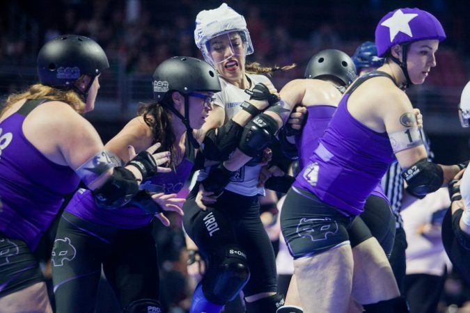 The Rose City Rollers of Portland, Oregon, face off against the Victorian Roller Derby League from Melbourne, Australia, in the championship game at the WFTDA International Championships at the Liacouras Center. (Brad Larrison for WHYY)