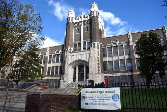 The Castle building at Camden High is currently fenced off awaiting demolition. A sign in front says that teachers and students have been moved to Hatch Junior High School temporarily. (April Saul/for Newsworks)