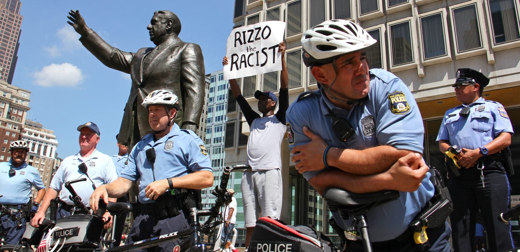 Philadelphia police protect the Frank Rizzo statue during a protest