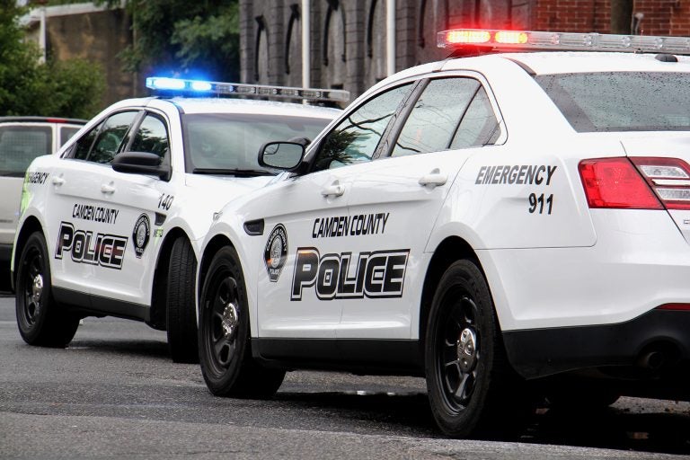 Camden police cars on the street with lights flashing