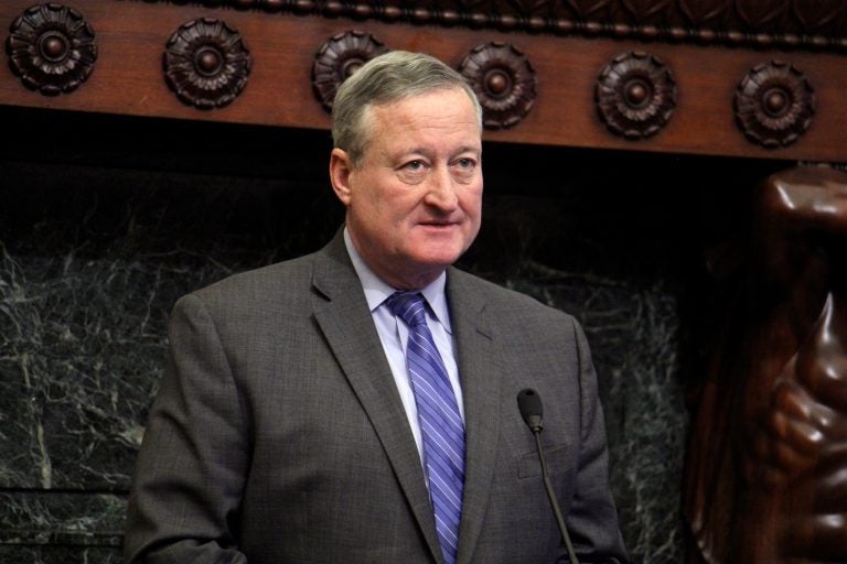 Philadelphia Mayor Jim Kenney stands behind a podium in the Mayor's Reception Room