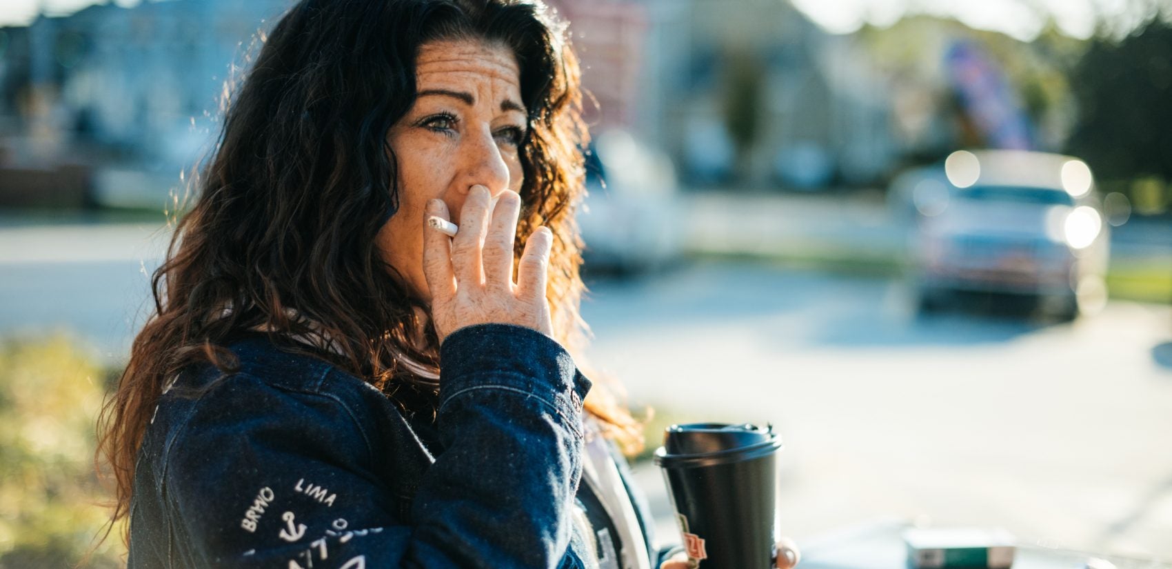 Redina pauses for a few minutes outside of the Sheetz in Shippensburg to sip her coffee and smoke a cigarette.