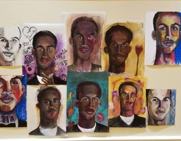 Portraits of the victims of gun violence hang on the walls at the chestnut hill presbyterian church