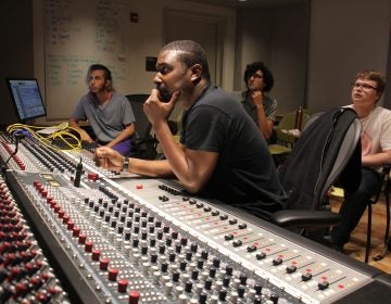 British musician Bitty McLean (center) works with Drexel students to remix tracks from the school's Sigma Sound archives