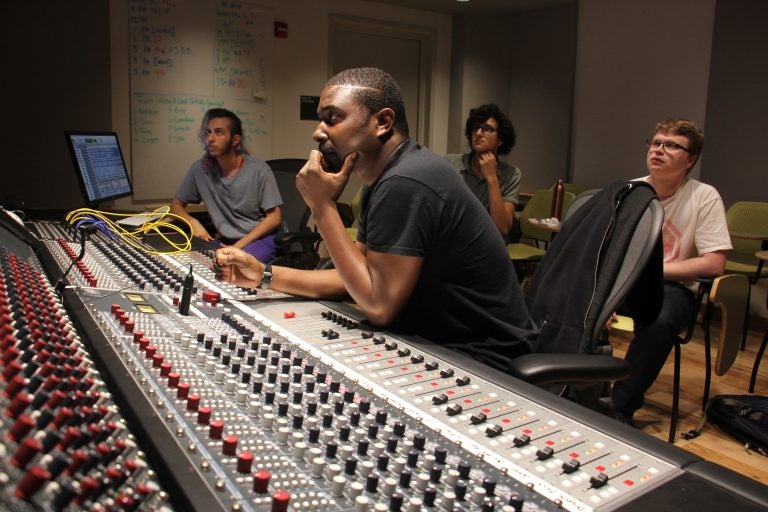 British musician Bitty McLean (center) works with Drexel students to remix tracks from the school's Sigma Sound archives