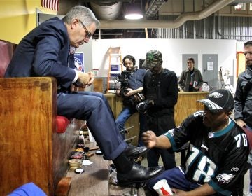 District attorney candidate Larry Krasner sits for a shoeshine