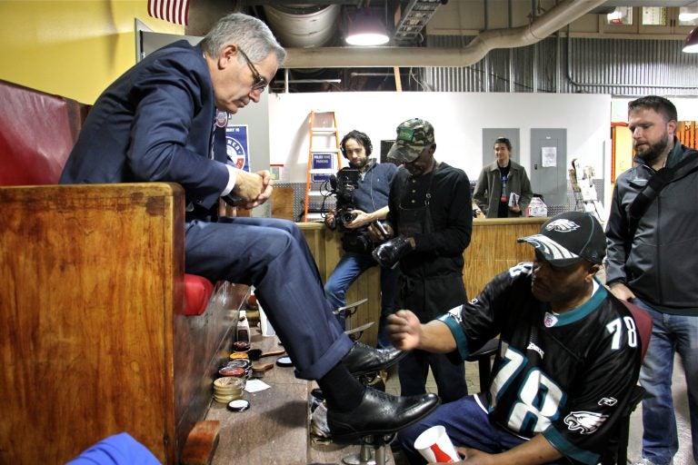 District attorney candidate Larry Krasner sits for a shoeshine