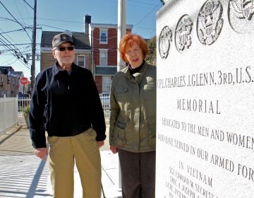 Jim Lonergan and Joyce Windfelder stand beside the Cpl. Charles J. Glenn Vietnam Veterans Memorial in Fishtown