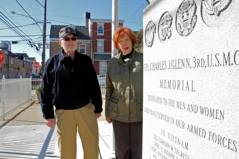 Jim Lonergan and Joyce Windfelder stand beside the Cpl. Charles J. Glenn Vietnam Veterans Memorial in Fishtown