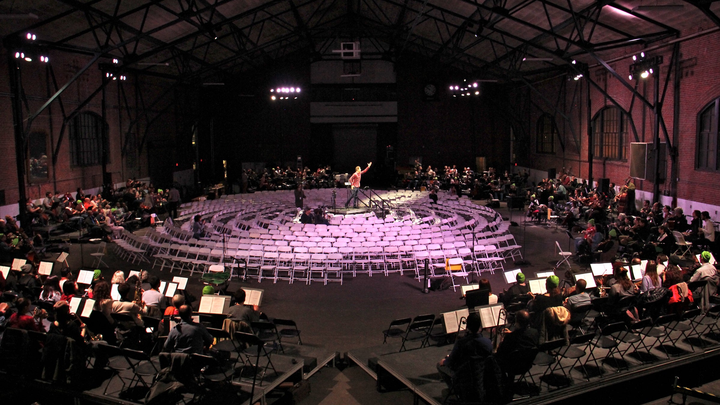 The musicians will surround the audience during the performance of "Symphony for a Broken Orchestra," at the Armory in Center City. Chairs are set for 575 audience members.