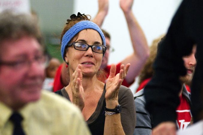 Attendees cheer during the monthly meeting of the School Reform Commission (Bastiaan Slabbers for WHYY)