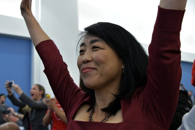 Councilwoman Helen Gym celebrates after the SRC votes itself out of function, after a marathon meeting on Thursday. (Bastiaan Slabbers for WHYY)