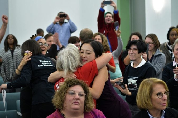 Educators, community members, and parents celebrate after the SRC votes itself out of function, after a marathon meeting on Thursday. (Bastiaan Slabbers for WHYY)