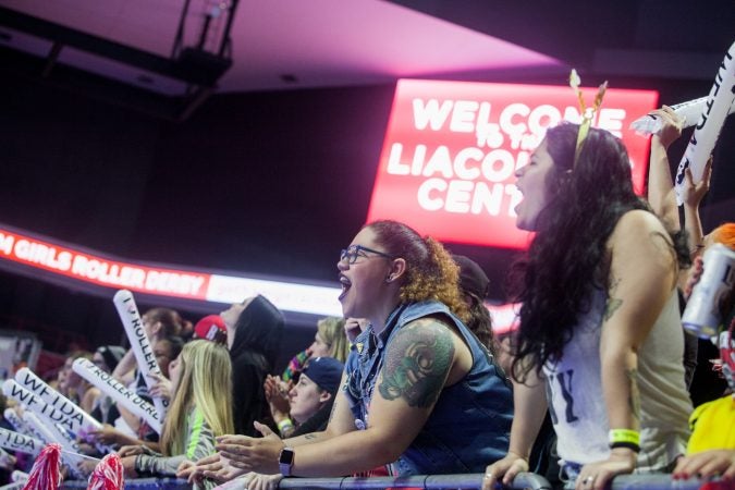 Fans cheer during the International WFTDA Championship at the Liacouras Center. (Brad Larrison for WHYY)