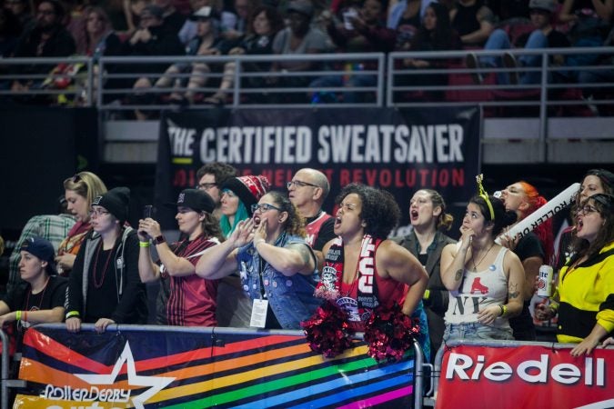 Fans cheer during the International WFTDA Championship at the Liacouras Center this weekend. (Brad Larrison for WHYY)