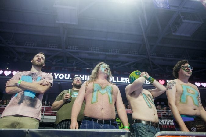 Fans of the Minnesota RollerGirls watch their game against the Angel City Derby Girls at the International WFTDA Championship at the Liacouras Center this weekend. (Brad Larrison for WHYY)