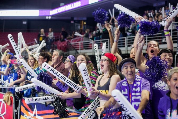 Fans cheer during the International WFTDA Championship at the Liacouras Center. (Brad Larrison for WHYY)