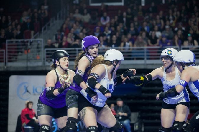 The Rose City Rollers of Portland, Oregon, face off against the Victorian Roller Derby League from Melbourne, Australia, in the championship game at the WFTDA International Championships at the Liacouras Center. (Brad Larrison for WHYY)